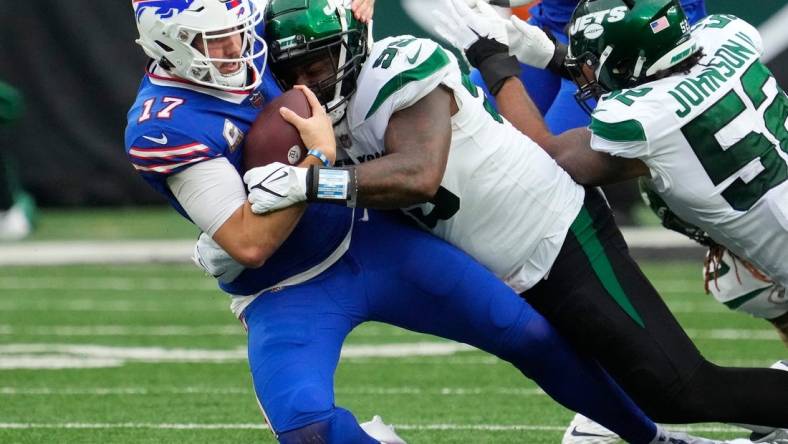 Nov 6, 2022; East Rutherford, NJ, USA; 
New York Jets defensive end Vinny Curry (99) tackles Buffalo Bills quarterback Josh Allen (17) in the second half at MetLife Stadium. Mandatory Credit: Robert Deutsch-USA TODAY Sports