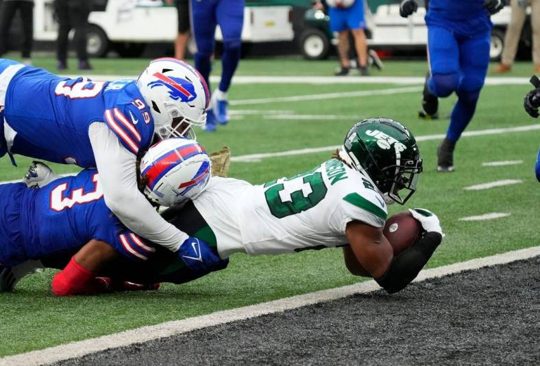 Nov 6, 2022; East Rutherford, NJ, USA; 
New York Jets running back James Robinson (23) scores a 4th quarter touchdown against the Bills at MetLife Stadium. Mandatory Credit: Robert Deutsch-USA TODAY Sports
