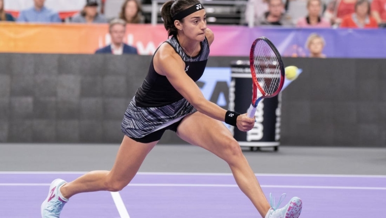 Nov 6, 2022; Forth Worth, TX, USA; Caroline Garcia (FRA) returns a shot during her match against Maria Sakkari (GRE) on day seven of the WTA Finals at Dickies Arena. Mandatory Credit: Susan Mullane-USA TODAY Sports