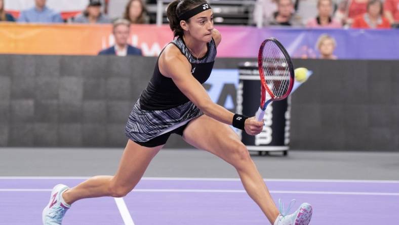 Nov 6, 2022; Forth Worth, TX, USA; Caroline Garcia (FRA) returns a shot during her match against Maria Sakkari (GRE) on day seven of the WTA Finals at Dickies Arena. Mandatory Credit: Susan Mullane-USA TODAY Sports