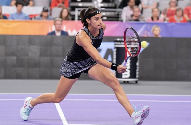 Nov 6, 2022; Forth Worth, TX, USA; Caroline Garcia (FRA) returns a shot during her match against Maria Sakkari (GRE) on day seven of the WTA Finals at Dickies Arena. Mandatory Credit: Susan Mullane-USA TODAY Sports