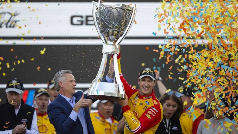 Nov 6, 2022; Avondale, Arizona, USA; NASCAR Cup Series driver Joey Logano celebrates after winning the Cup Championship at Phoenix Raceway. Mandatory Credit: Mark J. Rebilas-USA TODAY Sports