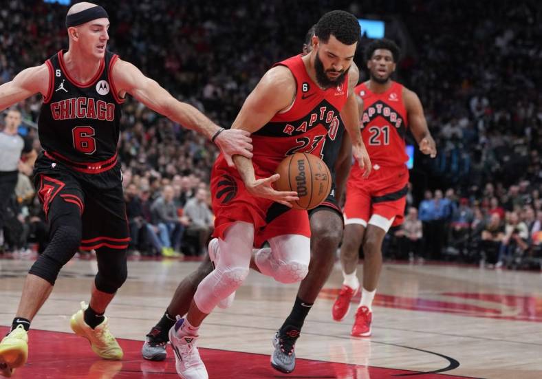 Nov 6, 2022; Toronto, Ontario, CAN; Toronto Raptors guard Fred VanVleet (23) controls the ball as Chicago Bulls guard Alex Caruso (6) tries to defend during the second quarter at Scotiabank Arena. Mandatory Credit: Nick Turchiaro-USA TODAY Sports
