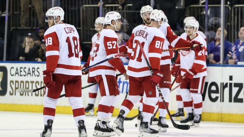 Nov 6, 2022; New York, New York, USA;  Detroit Red Wings left wing Dominik Kubalik (81) skates off the ice with his teammates after scoring the game winning goal in overtime to defeat the New York Rangers 3-2 at Madison Square Garden. Mandatory Credit: Wendell Cruz-USA TODAY Sports