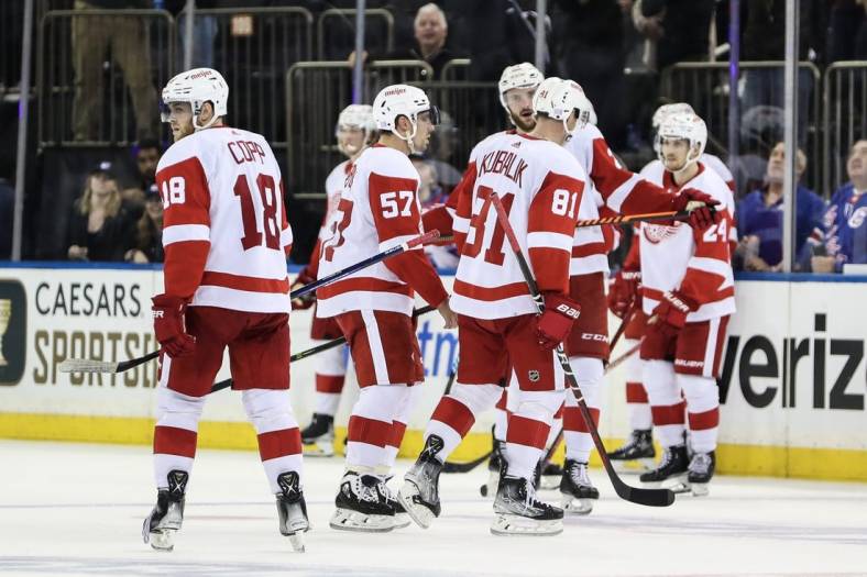 Nov 6, 2022; New York, New York, USA;  Detroit Red Wings left wing Dominik Kubalik (81) skates off the ice with his teammates after scoring the game winning goal in overtime to defeat the New York Rangers 3-2 at Madison Square Garden. Mandatory Credit: Wendell Cruz-USA TODAY Sports
