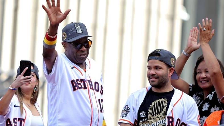 Nov 7, 2022; Houston, Texas, USA; Houston Astros manager Dusty Baker Jr. (12, left) and Houston Astros second baseman Jose Altuve (27) both wave to the crowd atop a parade vehicle during the Houston Astros Championship Parade in Houston, TX. Mandatory Credit: Erik Williams-USA TODAY Sports