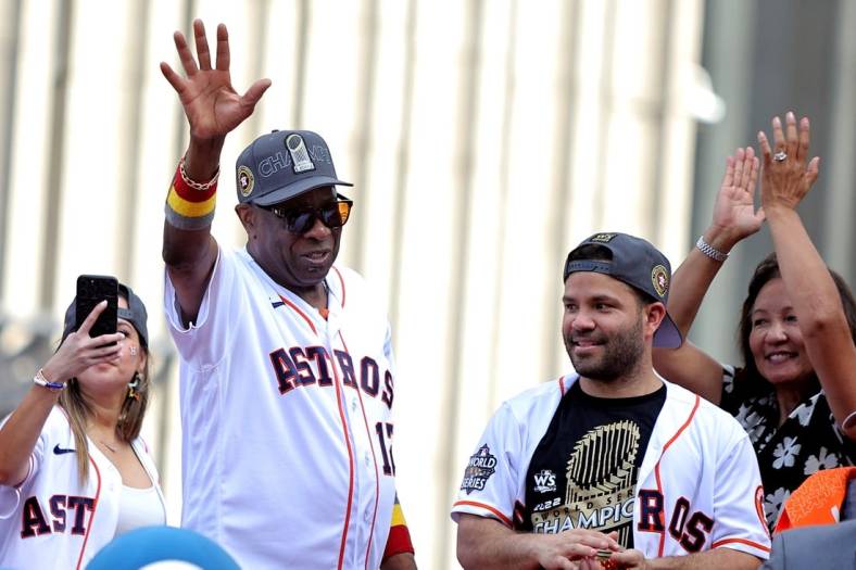 Nov 7, 2022; Houston, Texas, USA; Houston Astros manager Dusty Baker Jr. (12, left) and Houston Astros second baseman Jose Altuve (27) both wave to the crowd atop a parade vehicle during the Houston Astros Championship Parade in Houston, TX. Mandatory Credit: Erik Williams-USA TODAY Sports
