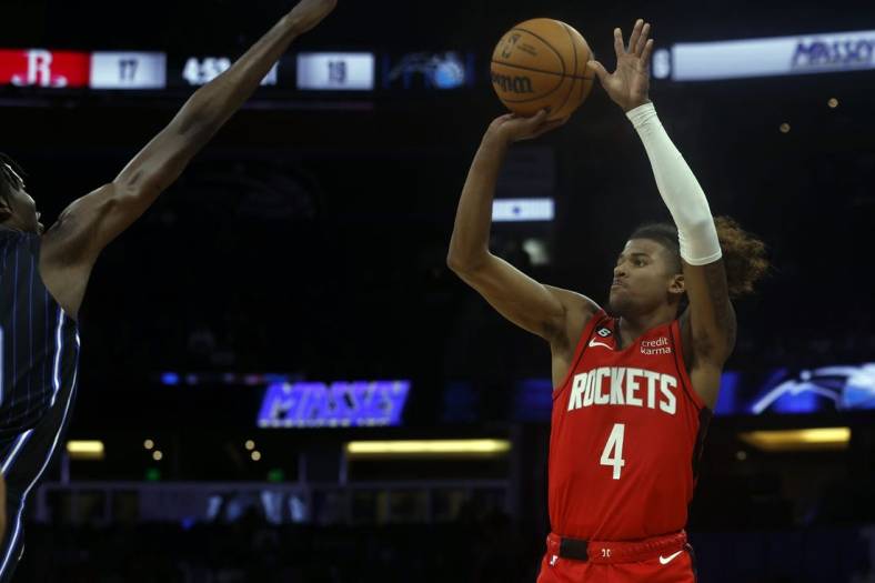 Nov 7, 2022; Orlando, Florida, USA; Houston Rockets guard Jalen Green (4) makes a three pointer against the Orlando Magic during the first quarter at Amway Center. Mandatory Credit: Kim Klement-USA TODAY Sports