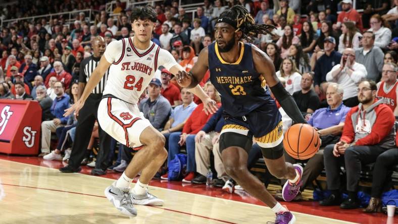 Nov 7, 2022; Queens, New York, USA;   of Merrimack Warriors guard Ziggy Reid (23) drives past St. John's Red Storm guard Rafael Pinzon (24) in the first half at Carnesecca Arena. Mandatory Credit: Wendell Cruz-USA TODAY Sports