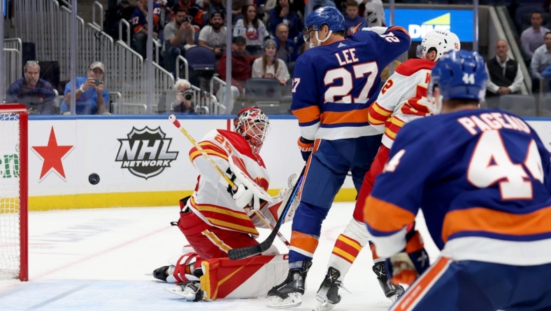 Nov 7, 2022; Elmont, New York, USA; Calgary Flames goaltender Jacob Markstrom (25) allows the game winning goal to New York Islanders defenseman Noah Dobson (not pictured) during overtime at UBS Arena. Mandatory Credit: Brad Penner-USA TODAY Sports