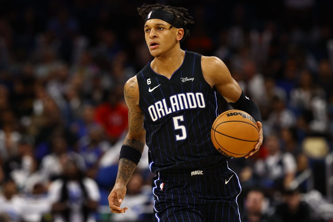 Nov 7, 2022; Orlando, Florida, USA; Orlando Magic forward Paolo Banchero (5) drives to the basket against the Houston Rockets during the second half at Amway Center. Mandatory Credit: Kim Klement-USA TODAY Sports