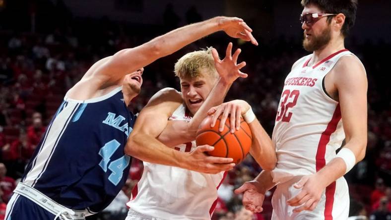 Nov 7, 2022; Lincoln, Nebraska, USA; Nebraska Cornhuskers guard Sam Griesel (5) fights for the ball against Maine Black Bears forward Peter Filipovity (44) during the second half at Pinnacle Bank Arena. Mandatory Credit: Dylan Widger-USA TODAY Sports