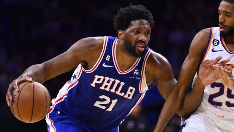 Nov 7, 2022; Philadelphia, Pennsylvania, USA; Philadelphia 76ers center Joel Embiid (21) drives against Phoenix Suns forward Mikal Bridges (25) in the second quarter at Wells Fargo Center. Mandatory Credit: Kyle Ross-USA TODAY Sports