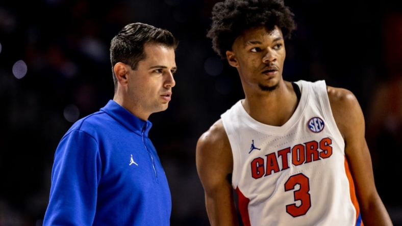 Nov 7, 2022; Gainesville, Florida, USA; Florida Gators head coach Todd Golden talks with Florida Gators forward Alex Fudge (3) in a timeout during the second half against the Stony Brook Seawolves at Exactech Arena at the Stephen C. O'Connell Center. Mandatory Credit: Matt Pendleton-USA TODAY Sports