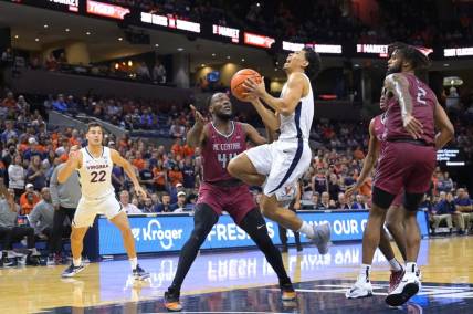 Nov 7, 2022; Charlottesville, Virginia, USA; Virginia Cavaliers guard Kihei Clark (0) drives to the basket in front of North Carolina Central Eagles forward Daniel Oladapo (44) in the first half at John Paul Jones Arena. Mandatory Credit: Lee Luther Jr.-USA TODAY Sports