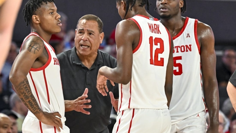 Nov 7, 2022; Houston, Texas, USA; Houston Cougars head coach Kelvin Sampson speaks with guard Tramon Mark (12) and guard Marcus Sasser (0) and forward Jarace Walker (25) during the second half against the Northern Colorado Bears at Fertitta Center. Mandatory Credit: Maria Lysaker-USA TODAY Sports