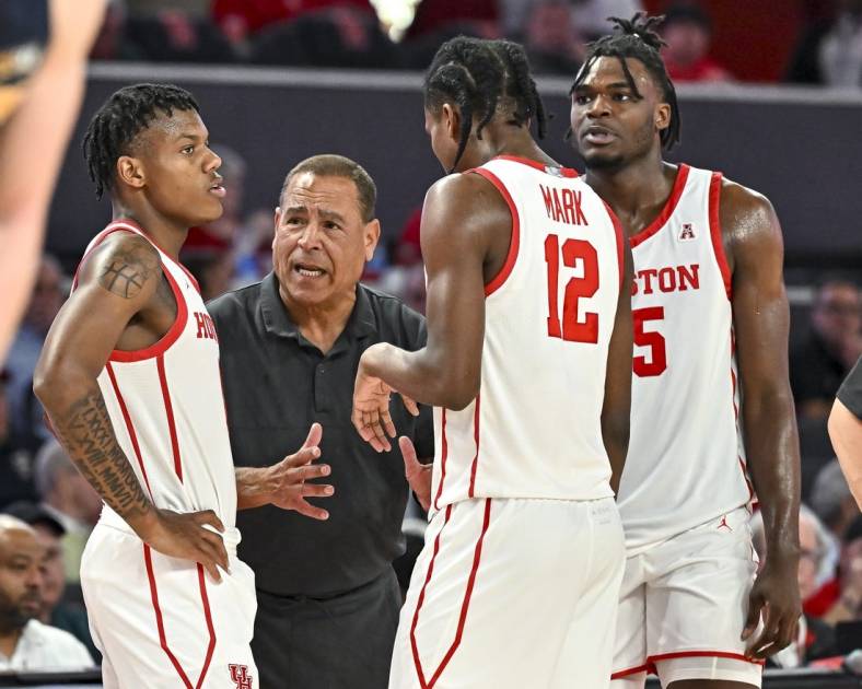 Nov 7, 2022; Houston, Texas, USA; Houston Cougars head coach Kelvin Sampson speaks with guard Tramon Mark (12) and guard Marcus Sasser (0) and forward Jarace Walker (25) during the second half against the Northern Colorado Bears at Fertitta Center. Mandatory Credit: Maria Lysaker-USA TODAY Sports