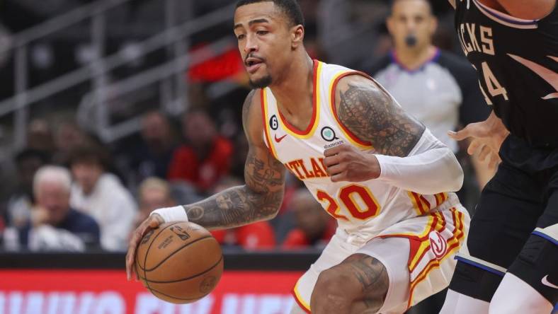 Nov 7, 2022; Atlanta, Georgia, USA; Atlanta Hawks forward John Collins (20) drives to the basket against the Milwaukee Bucks in the second quarter at State Farm Arena. Mandatory Credit: Brett Davis-USA TODAY Sports