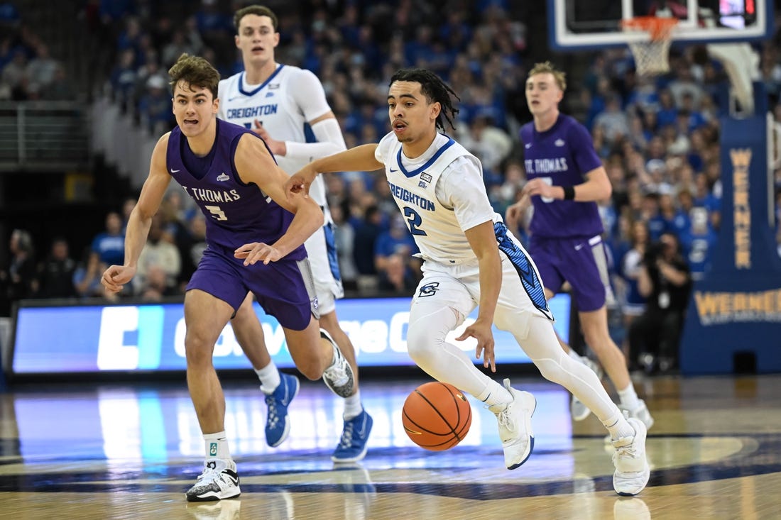 Nov 7, 2022; Omaha, Nebraska, USA;  Creighton Bluejays guard Ryan Nembhard (2) drives up the court against St. Thomas - Minnesota Tommies forward Parker Bjorklund (5)during the second half at CHI Health Center Omaha. Mandatory Credit: Steven Branscombe-USA TODAY Sports