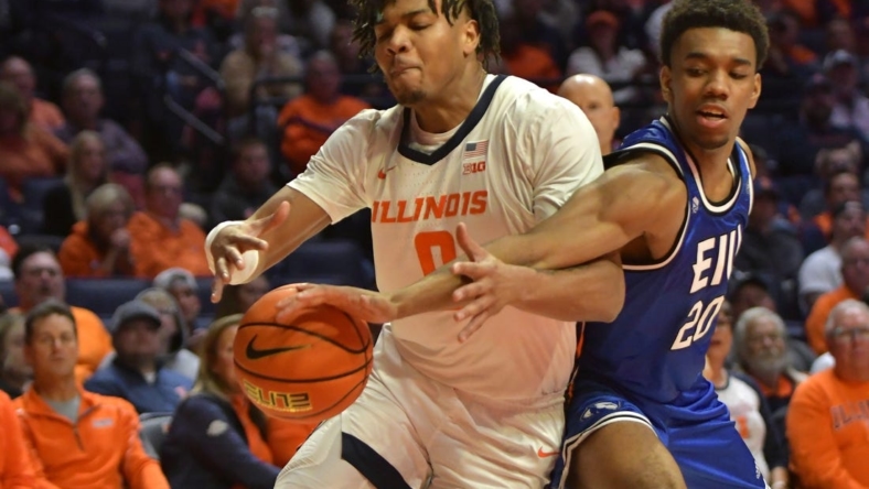 Nov 7, 2022; Champaign, Illinois, USA; Eastern Illinois Panthers guard Caleb Donaldson (20) slaps the ball from Illinois Fighting Illini guard Terrence Shannon Jr. (0) during the first half at State Farm Center. Mandatory Credit: Ron Johnson-USA TODAY Sports