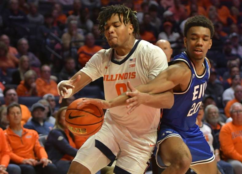 Nov 7, 2022; Champaign, Illinois, USA; Eastern Illinois Panthers guard Caleb Donaldson (20) slaps the ball from Illinois Fighting Illini guard Terrence Shannon Jr. (0) during the first half at State Farm Center. Mandatory Credit: Ron Johnson-USA TODAY Sports