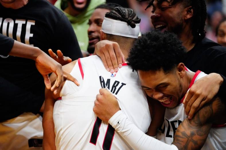Nov 7, 2022; Miami, Florida, USA; Portland Trail Blazers guard Josh Hart (11) celebrates the game winning basket with team mates against the Miami Heat during the fourth quarter at FTX Arena. Mandatory Credit: Rich Storry-USA TODAY Sports