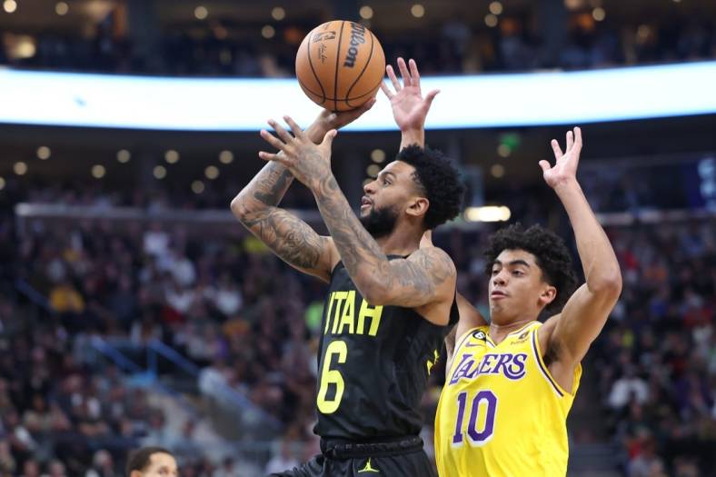 Nov 7, 2022; Salt Lake City, Utah, USA; Utah Jazz guard Nickeil Alexander-Walker (6) shoots the ball against Los Angeles Lakers guard Max Christie (10) in the second quarter at Vivint Arena. Mandatory Credit: Rob Gray-USA TODAY Sports