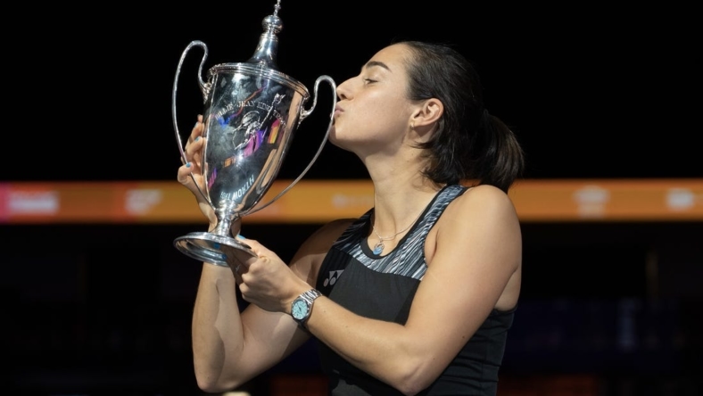 Nov 7, 2022; Forth Worth, TX, USA; Caroline Garcia (FRA) kisses the trophy after winning the WTA Finals in singles after defeating Aryna Sabalenka on day eight of the WTA Finals at Dickies Arena.