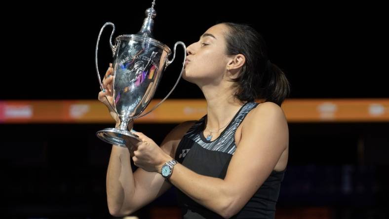 Nov 7, 2022; Forth Worth, TX, USA; Caroline Garcia (FRA) kisses the trophy after winning the WTA Finals in singles after defeating Aryna Sabalenka on day eight of the WTA Finals at Dickies Arena.