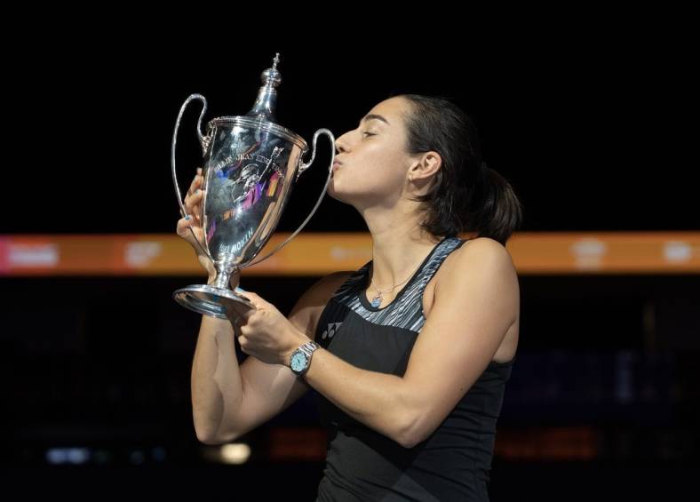 Nov 7, 2022; Forth Worth, TX, USA; Caroline Garcia (FRA) kisses the trophy after winning the WTA Finals in singles after defeating Aryna Sabalenka on day eight of the WTA Finals at Dickies Arena.