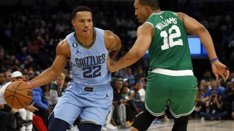 Nov 7, 2022; Memphis, Tennessee, USA; Memphis Grizzlies guard Desmond Bane (22) dribbles around Boston Celtics forward Grant Williams (12) during the first half at FedExForum. Mandatory Credit: Petre Thomas-USA TODAY Sports