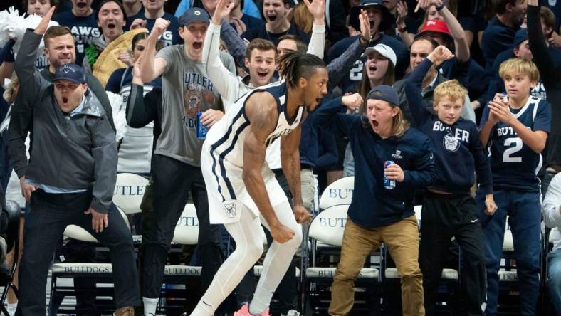 Butler Bulldogs fans celebrate with Butler Bulldogs center Manny Bates (15) after throwing down a dunk Monday, Nov. 7, 2022, at Hinkle Fieldhouse in Indianapolis.

Butler 11072022 Af037