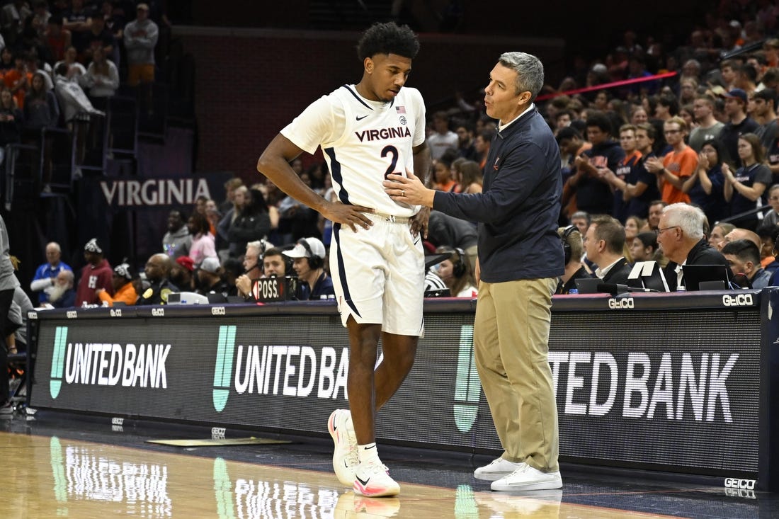 Nov 7, 2022; Charlottesville, Virginia, USA; Virginia Cavaliers guard Reece Beekman (2) has a chat with head coach Tony Bennett before taking a seat on the bench in game against North Carolina Central in the second half at John Paul Jones Arena. Mandatory Credit: Lee Luther Jr.-USA TODAY Sports