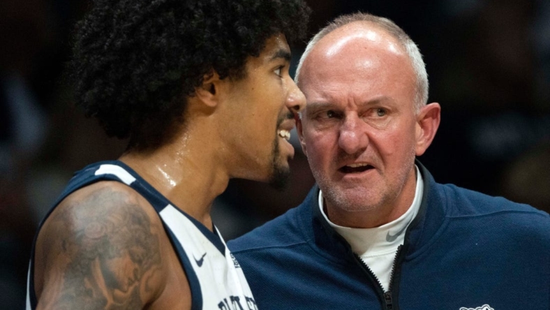 Butler Bulldogs head coach Thad Matta speaks with Butler Bulldogs forward D.J. Hughes (0) on Monday, Nov. 7, 2022, at Hinkle Fieldhouse in Indianapolis.

Butler 11072022 Af034