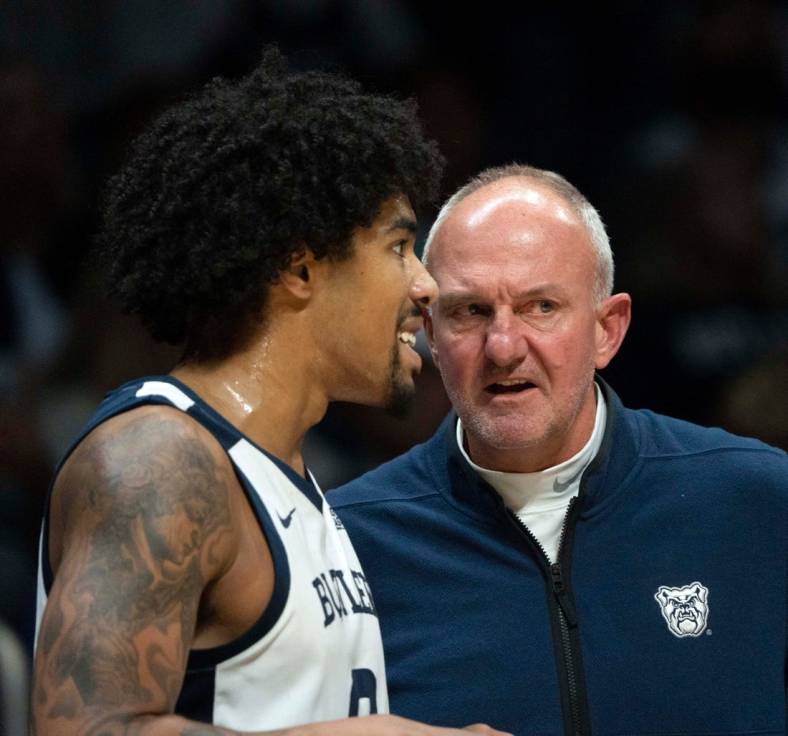 Butler Bulldogs head coach Thad Matta speaks with Butler Bulldogs forward D.J. Hughes (0) on Monday, Nov. 7, 2022, at Hinkle Fieldhouse in Indianapolis.

Butler 11072022 Af034