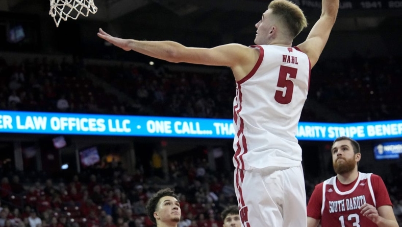 Wisconsin forward Tyler Wahl (5) dunks during the second half of their game  Monday, November 7, 2022 at the Kohl Center in Madison, Wis. Wisconsin beat South Dakota 85-59.

Uwgrid07 14