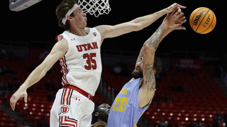 Nov 7, 2022; Salt Lake City, Utah, USA;  Utah Utes center Branden Carlson (35) and LIU Sharks forward Jake Cook (20) battle for the ball in the first half at Jon M. Huntsman Center. Mandatory Credit: Jeffrey Swinger-USA TODAY Sports