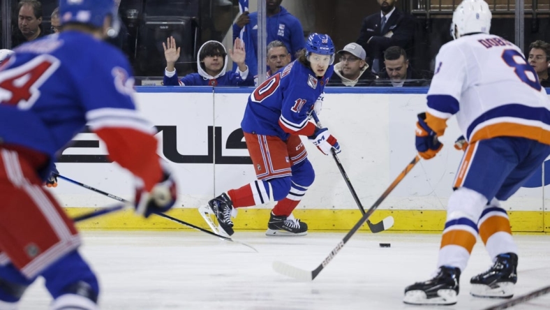 Nov 8, 2022; New York, New York, USA; New York Rangers left wing Artemi Panarin (10) skates with the puck against the New York Islanders during the first period of a game at Madison Square Garden. Mandatory Credit: Jessica Alcheh-USA TODAY Sports