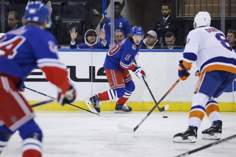 Nov 8, 2022; New York, New York, USA; New York Rangers left wing Artemi Panarin (10) skates with the puck against the New York Islanders during the first period of a game at Madison Square Garden. Mandatory Credit: Jessica Alcheh-USA TODAY Sports