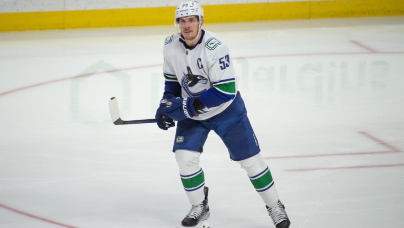 Nov 8, 2022; Ottawa, Ontario, CAN; Vancouver Canucks center Bo Horvat (52) skates back to the bench following his goal in the third period against the Ottawa Senators at the Canadian Tire Centre. Mandatory Credit: Marc DesRosiers-USA TODAY Sports