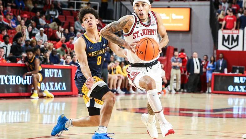 Nov 7, 2022; Queens, New York, USA;  St. John's Red Storm guard Andre Curbelo (3) and Merrimack Warriors guard Chevalier Emery (0) at Carnesecca Arena. Mandatory Credit: Wendell Cruz-USA TODAY Sports