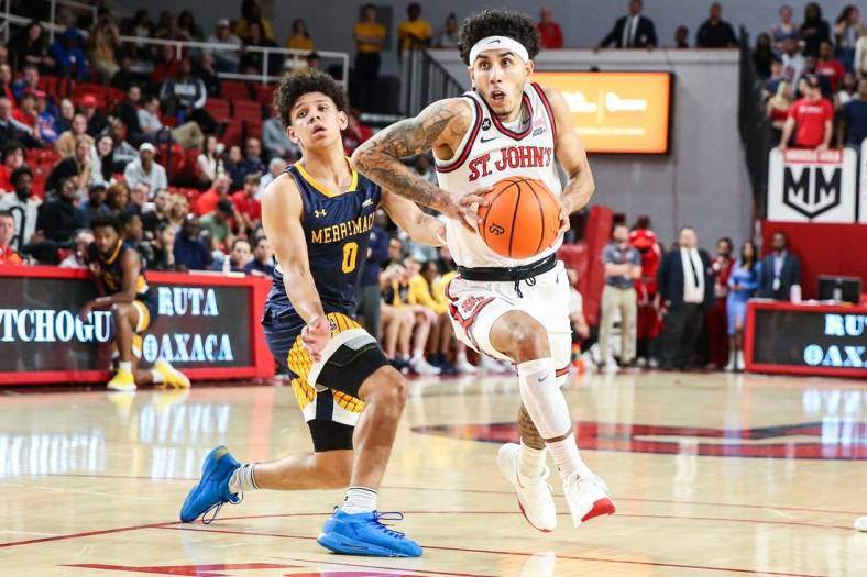 Nov 7, 2022; Queens, New York, USA;  St. John's Red Storm guard Andre Curbelo (3) and Merrimack Warriors guard Chevalier Emery (0) at Carnesecca Arena. Mandatory Credit: Wendell Cruz-USA TODAY Sports