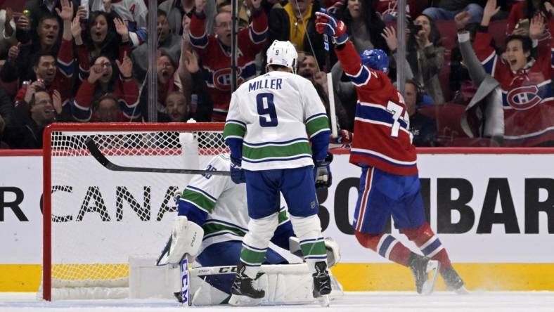 Nov 9, 2022; Montreal, Quebec, CAN; Montreal Canadiens forward Kirby Dach (77) scores a goal against Vancouver Canucks goalie Thatcher Demko (35) during the first period at the Bell Centre. Mandatory Credit: Eric Bolte-USA TODAY Sports