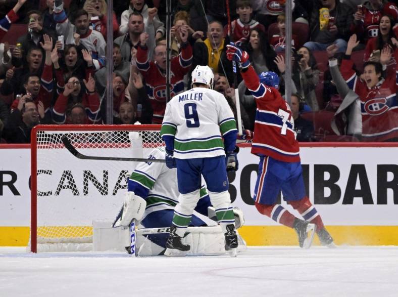 Nov 9, 2022; Montreal, Quebec, CAN; Montreal Canadiens forward Kirby Dach (77) scores a goal against Vancouver Canucks goalie Thatcher Demko (35) during the first period at the Bell Centre. Mandatory Credit: Eric Bolte-USA TODAY Sports