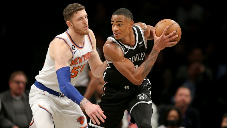 Nov 9, 2022; Brooklyn, New York, USA; Brooklyn Nets forward Nic Claxton (33) controls the ball against New York Knicks center Isaiah Hartenstein (55) during the first quarter at Barclays Center. Mandatory Credit: Brad Penner-USA TODAY Sports