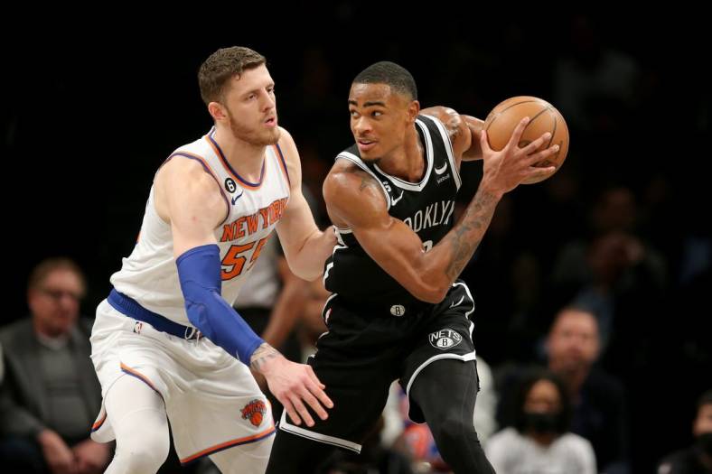 Nov 9, 2022; Brooklyn, New York, USA; Brooklyn Nets forward Nic Claxton (33) controls the ball against New York Knicks center Isaiah Hartenstein (55) during the first quarter at Barclays Center. Mandatory Credit: Brad Penner-USA TODAY Sports