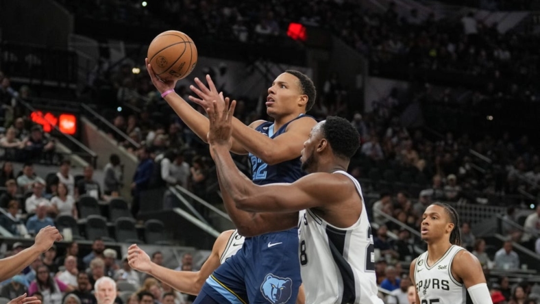 Nov 9, 2022; San Antonio, Texas, USA;  Memphis Grizzlies guard Desmond Bane (22) shoots in front of San Antonio Spurs center Charles Bassey (28) in the first half at the AT&T Center. Mandatory Credit: Daniel Dunn-USA TODAY Sports