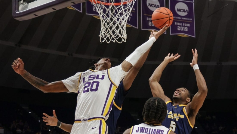 Nov 9, 2022; Baton Rouge, Louisiana, USA; LSU Tigers forward Derek Fountain (20) grabs a rebound against UMKC Kangaroos guard Shemarri Allen (5) during the second half at Pete Maravich Assembly Center. Mandatory Credit: Stephen Lew-USA TODAY Sports