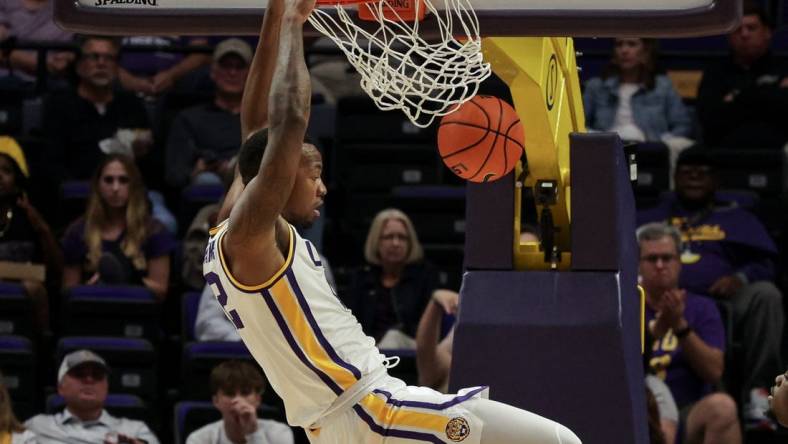 Nov 9, 2022; Baton Rouge, Louisiana, USA; LSU Tigers forward KJ Williams (12) dunks the ball against the UMKC Kangaroos during the second half at Pete Maravich Assembly Center. Mandatory Credit: Stephen Lew-USA TODAY Sports