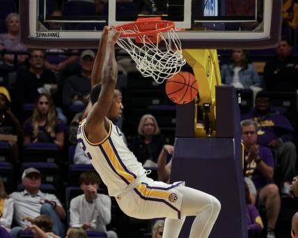 Nov 9, 2022; Baton Rouge, Louisiana, USA; LSU Tigers forward KJ Williams (12) dunks the ball against the UMKC Kangaroos during the second half at Pete Maravich Assembly Center. Mandatory Credit: Stephen Lew-USA TODAY Sports